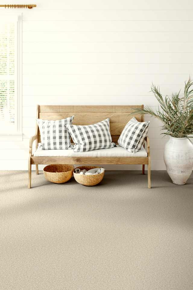 beige cut pile carpet in farmhouse chic entryway with wooden bench